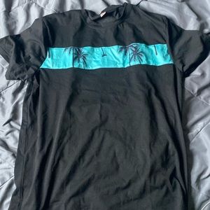 A nice black tee with tropical trees